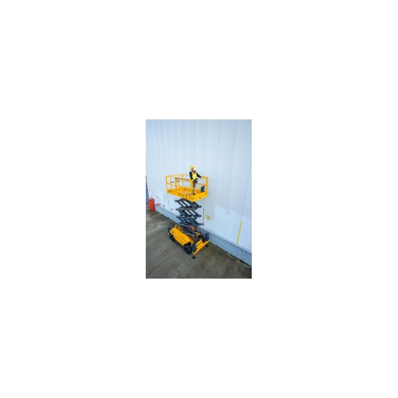 Haulotte COMPACT 12 DX i bruk ute foran en hvit vegg